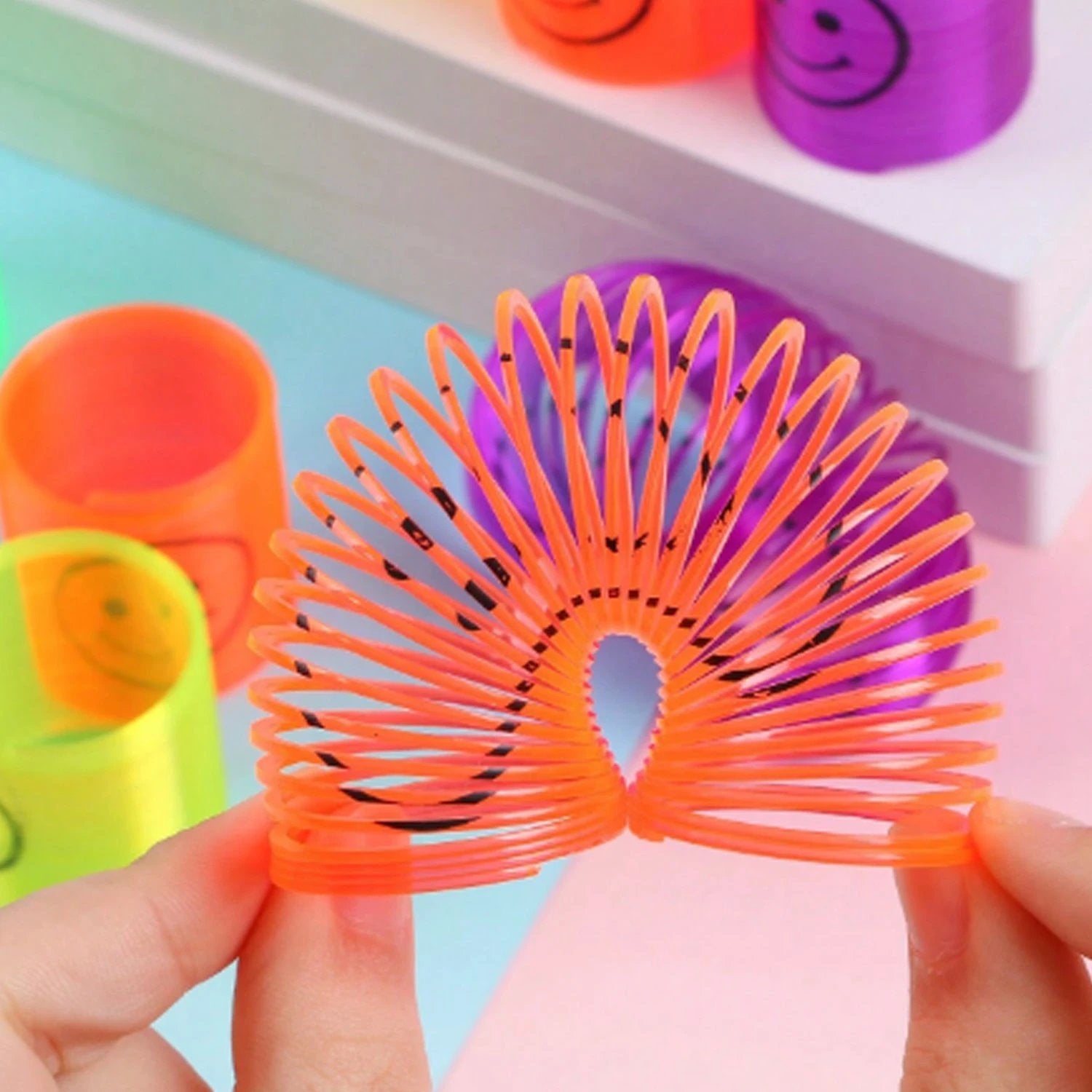Multicolor Smiley Spring Slinky Toy - 69KART