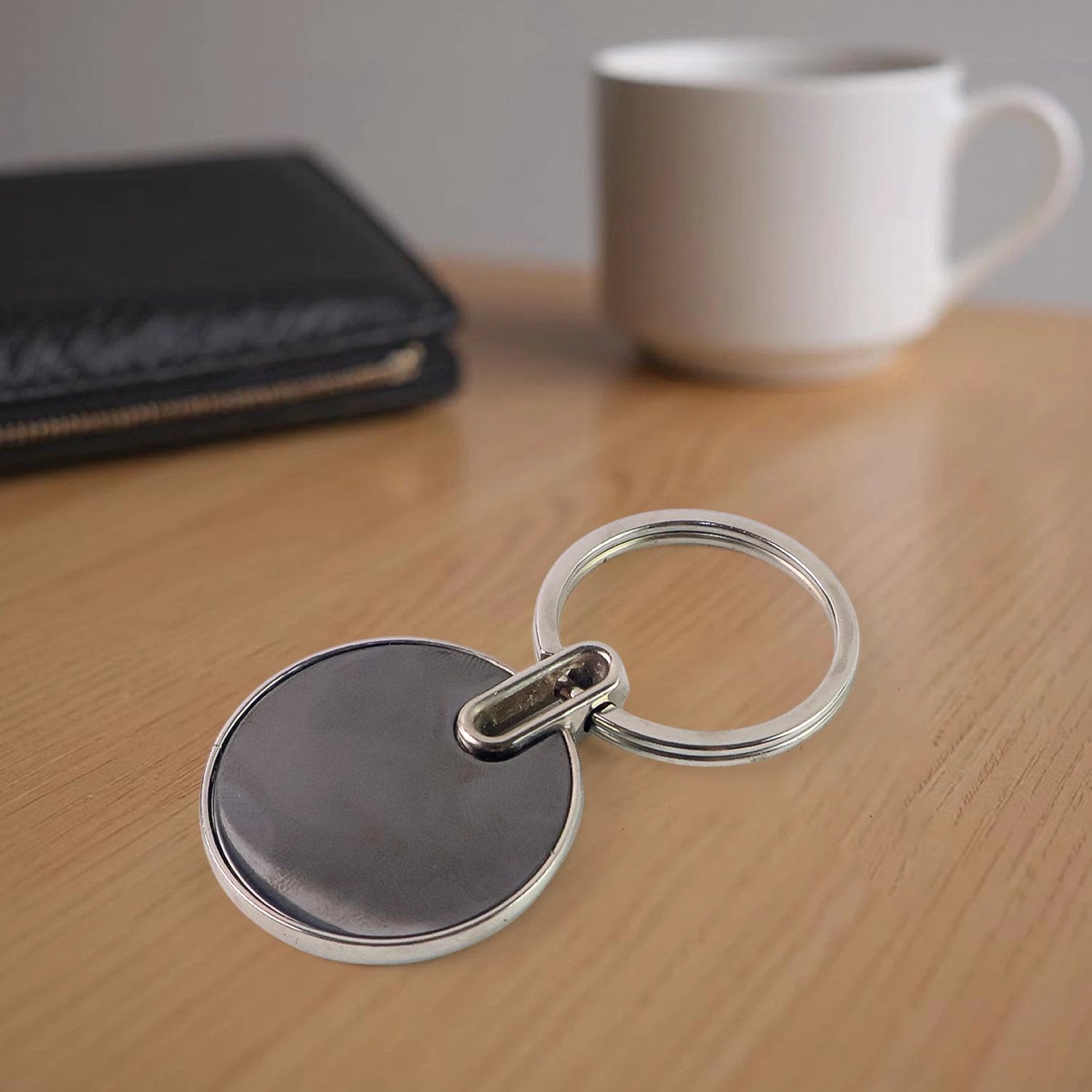 Black Round Metal Keychain by Wukusy